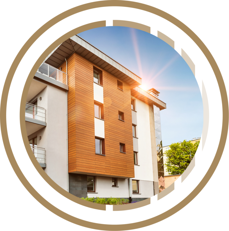 Modern apartment building with wood paneling and white walls in bright sunlight under a clear blue sky